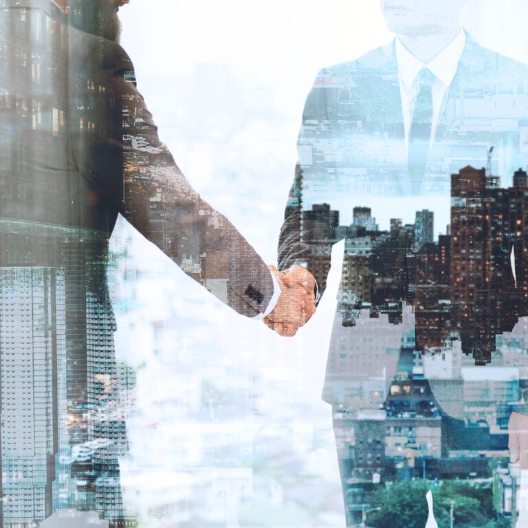 Momentum Commerce | corporate business handshake business partners