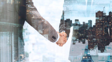 Momentum Commerce | corporate business handshake business partners